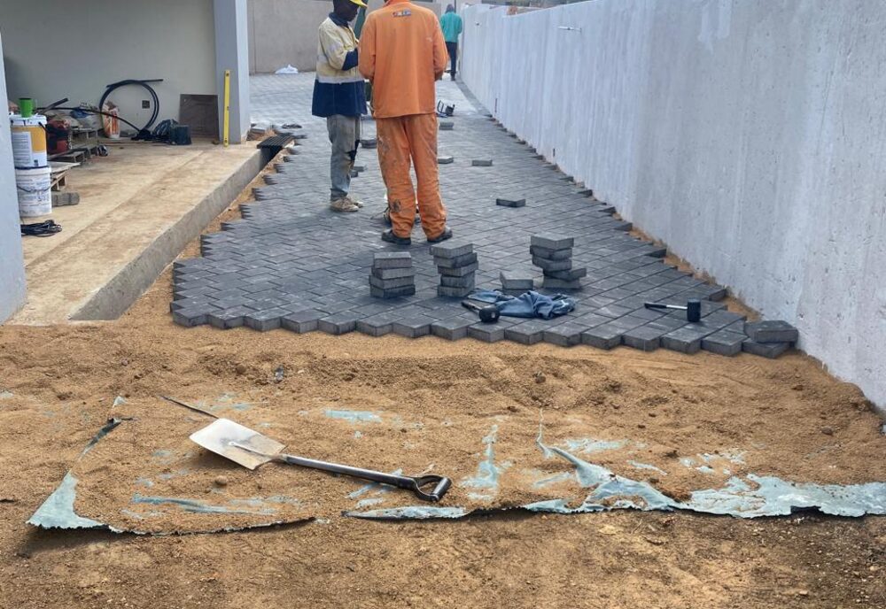 Driveway paving and exterior refinishing on site
