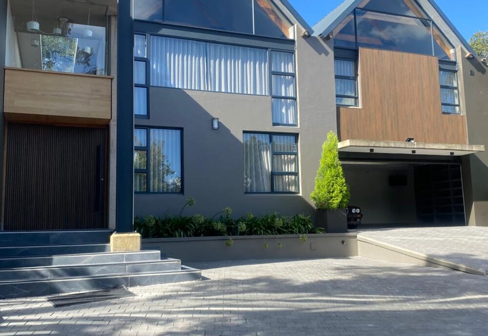 Glazed gable-roof residence exterior
