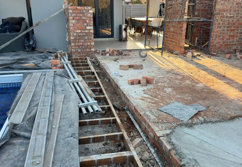 Steel-frame deck and brickwork under construction